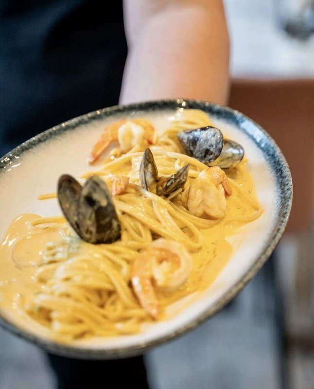 Seafood linguine with bisque and white sauce