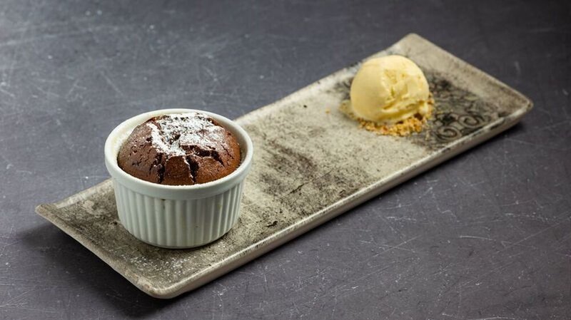 Chocolate moelleux flavored with tonka bean and rum, served with vanilla ice cream